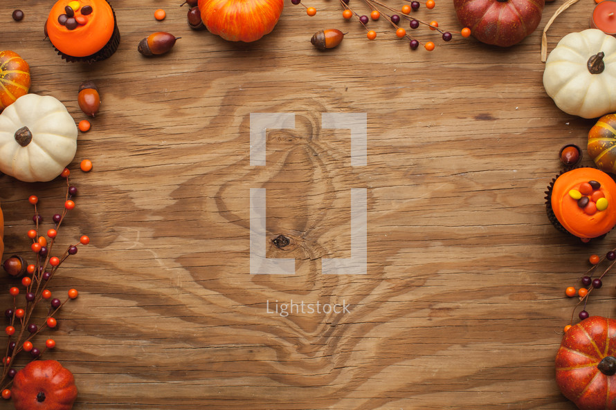 fall themed border on wood background 