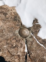 geological survey marker in rock 