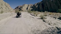 driving through the desert in a Jeep 