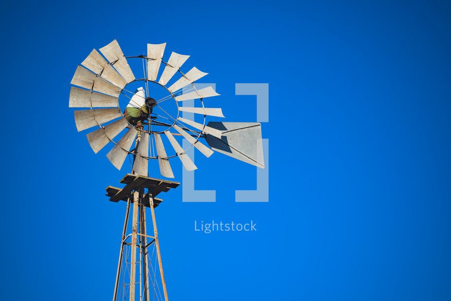 windmill against a blue sky 