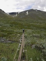 person hiking highlands in Northern Sweden 