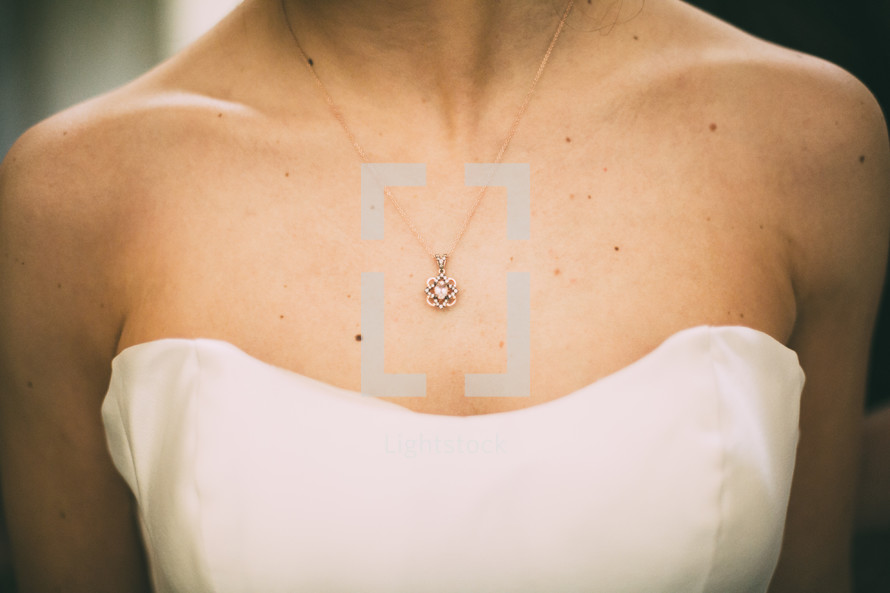 necklace around the neck of a bride 