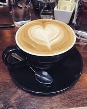 heart shape creamer in a cup of coffee 