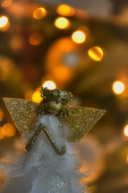 Christmas angel against bokeh Christmas lights 