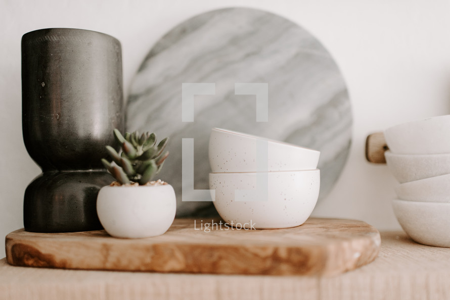 marble cutting board and white bowls 