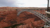 Traffic on an arched bridge over Glen Canyon