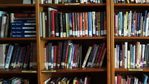 Library shelves with Christian books