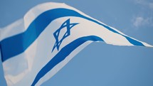 Waving Israel Flag by the wind in the sky
