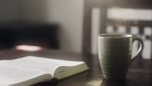 open Bible and a steaming cup of coffee 