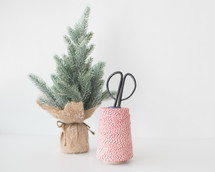 small Christmas tree with twine and scissors 