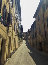 stone alley between buildings in Siena, Italy 