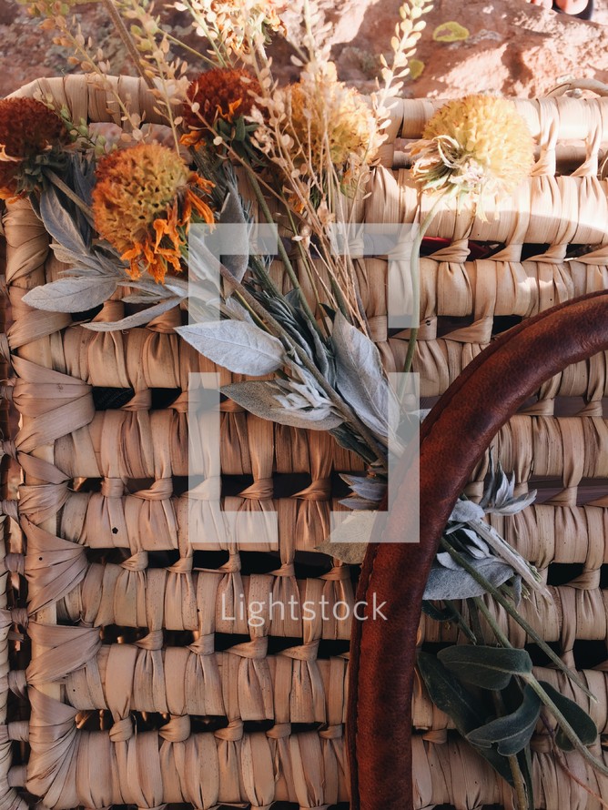 dried flowers on a picnic basket 