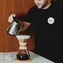 man slow brewing coffee 
