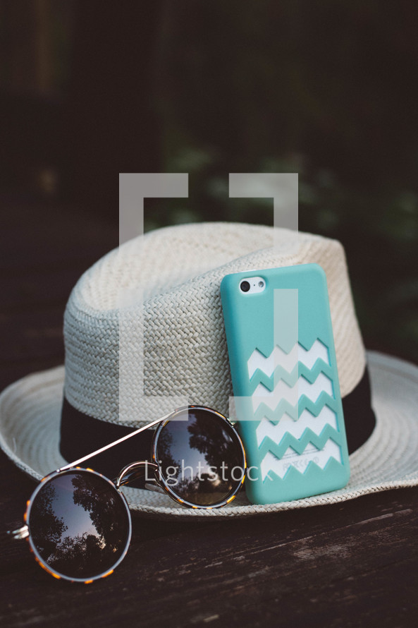 hat, sunglasses, summer, outdoors, table, phone, iPhone, cellphone