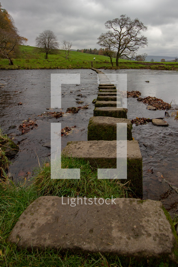 Stepping stones on a public footpath crossing the River Hodder near The Inn at Whitewell, Lancashire, England, United Kingdom