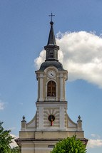 A church with a clock tower is in Medias, Romania