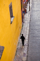 man walking on a sidewalk 