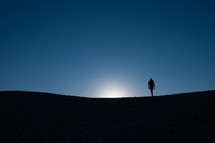 silhouette of a person walking 