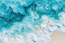 Aerial view of a beautiful turquoise ocean wave gently washing onto a sandy beach, with intricate patterns formed by the foam. The scene is serene and evokes coastal tranquility.