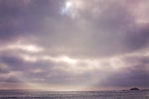 halo of sunlight and cloudy sky over the ocean 
