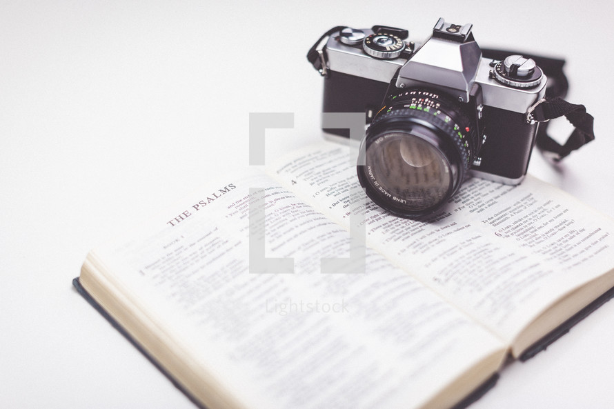 camera on an open Bible 