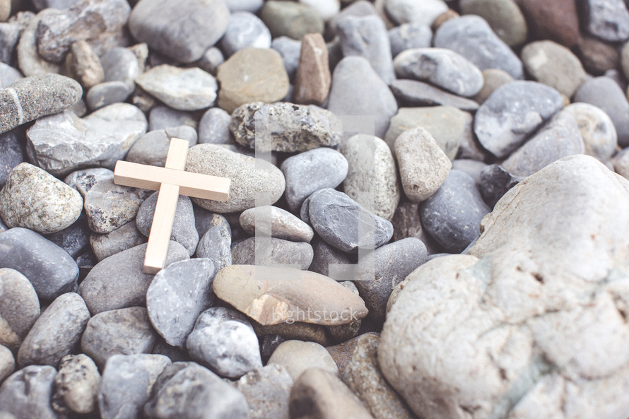 cross on pebbles 
