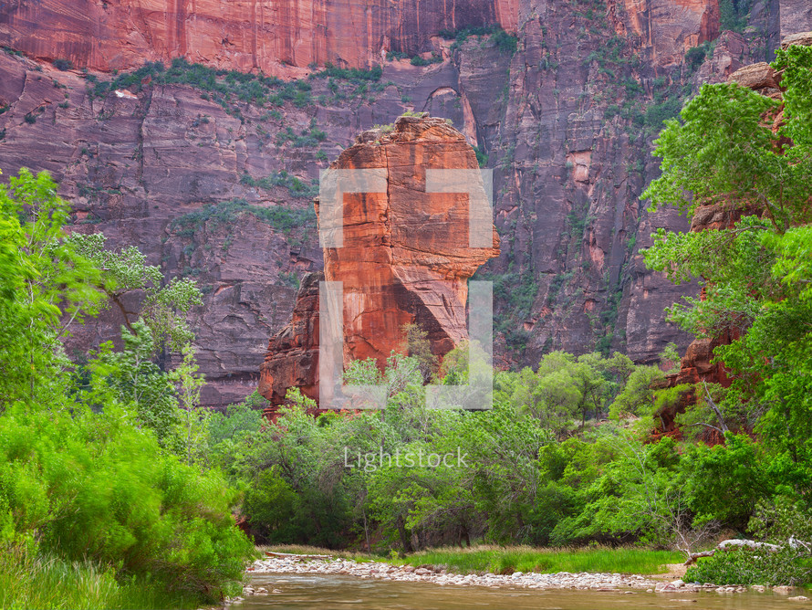 red rock cliffs and flowing river 