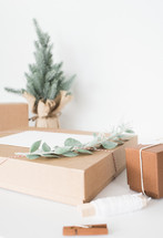 brown boxes with green twigs for Christmas 