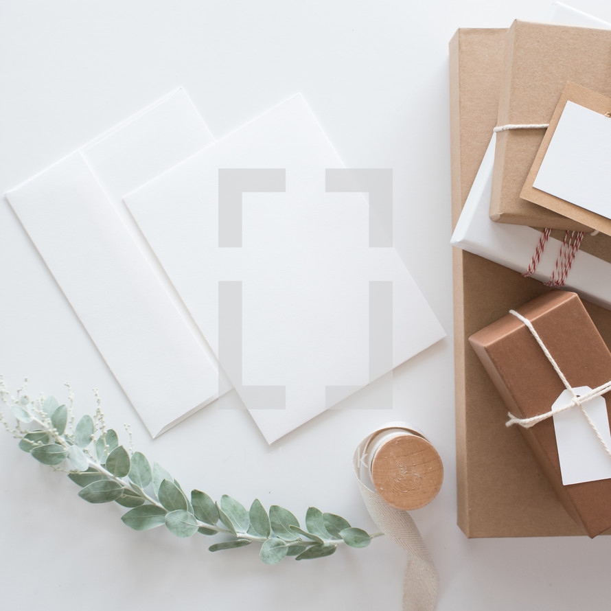 envelopes and brown gift boxes 