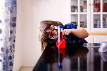 a girl doing a chemistry experiment 