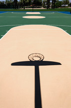 shadows on a basketball court outdoors 