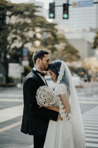 portrait of a bride and groom in a city 