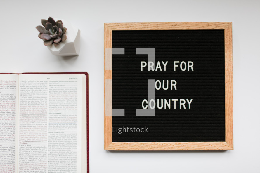 pray for our country and open Bible 