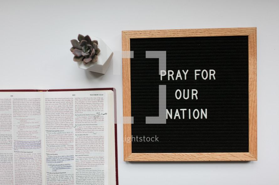 pray for our government sign and open Bible 