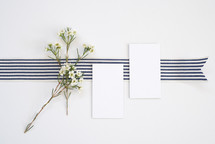 blank white notecard and striped ribbon 