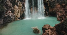 Natural Pool Under The El Chiflon Waterfall Tumbles Over Rocks In Chiapas, Mexico. - aerial	