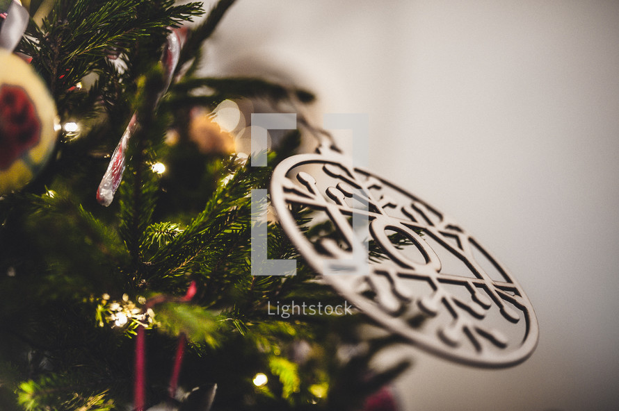 joy ornament on a Christmas tree 