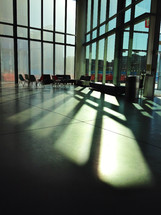 sunlight shining through windows into a lobby 