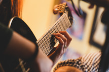 hands playing classic guitar. Selective focus.