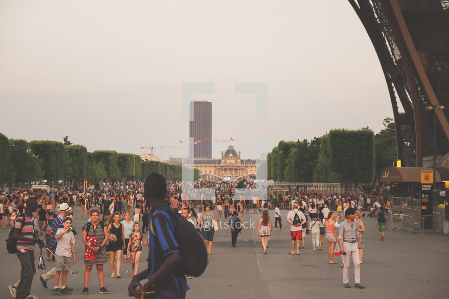 crowds of people under the Eiffel Tower in Paris 