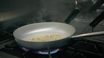 Frying Pan With Olive Oil Juice And Putting Black Ink Squid Spaghetti Pasta