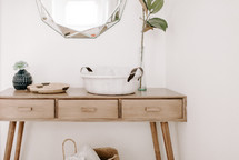 mirror over a side table 