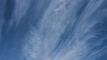 wispy clouds in a blue sky 