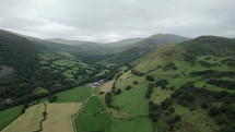 4K Aerial Drone Footage Towards Village In Countryside Rural England Uk
