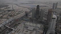 Buildings under construction in Dubai. Drone, aeiral view of downtown Dubai buildings and skyscrapers from the Burj Khalifa in the middle eastern country of United Arab Emirates.