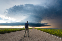 Storm Chaser Photographer Capturing The Moment A Huge Storm Crosses The Road