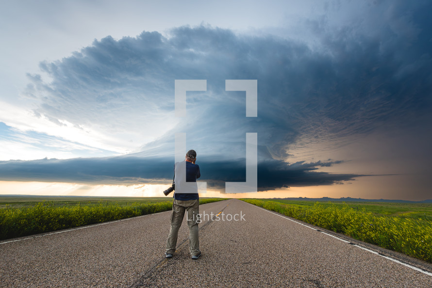 Storm Chaser Photographer Capturing The Moment A Huge Storm Crosses The Road