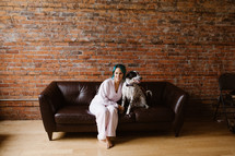 women with her dog on a couch 