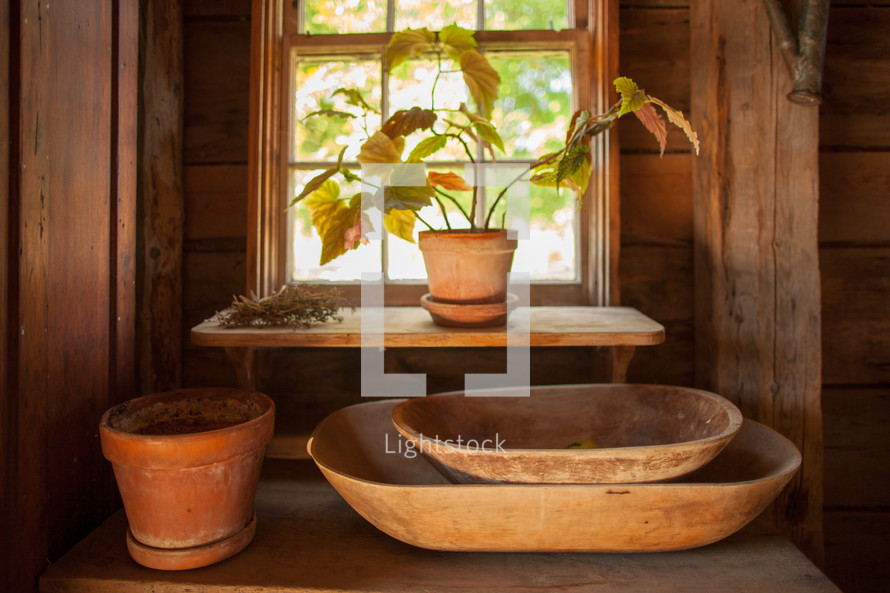 old wooden bowls in a window 
