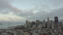 Downtown San Francisco | Aerial | Neighborhood | Community | People | Urban | Evangelism | World | Buildings | Skyscrapers | Bay Bridge | Bay Area | Clouds | Evening 